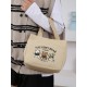 A large-capacity, cute and versatile student canvas bag, a handbag for female mothers to carry when going out, and a commuting bento bag for office workers