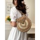 The 2025 new straw-woven bag features a niche design for women, is a fashionable and versatile small round bag that can be carried across the body for beach vacations